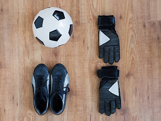 Image showing close up of soccer ball, boots and gloves