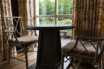 Image showing close up of vintage chairs and table at home