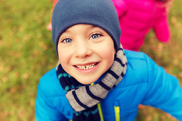 Image showing happy little boy face outdoors