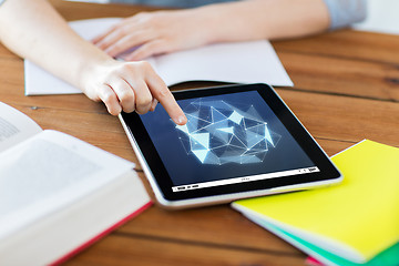 Image showing close up of student with tablet pc and notebook