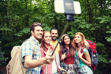 Image showing friends with backpack taking selfie by smartphone