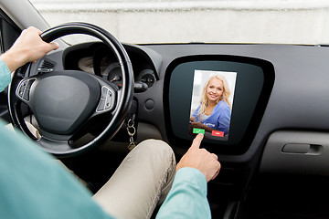 Image showing close up of man driving car and receiving call