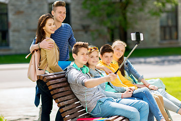 Image showing happy teenage students taking selfie by smartphone