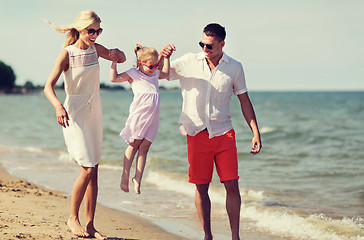 Image showing happy family in sunglasses on summer beach