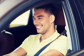 Image showing happy smiling man driving car outdoors