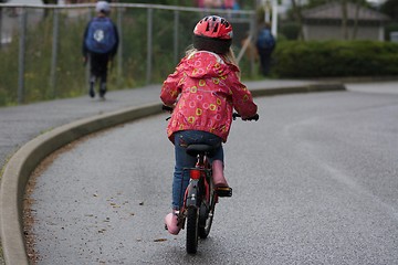 Image showing Many children have already learned to ride a bike before school begins.