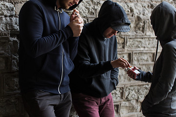 Image showing close up of young people smoking cigarettes