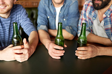 Image showing happy male friends drinking beer at bar or pub