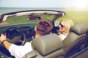 Image showing happy man and woman driving in cabriolet car