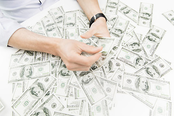 Image showing close up of male businessman hands with money