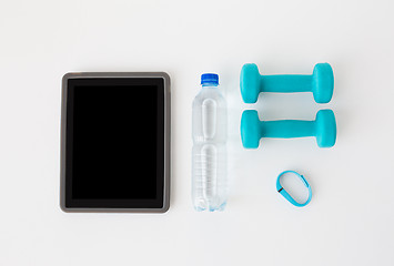 Image showing tablet pc, dumbbells, fitness tracker and bottle