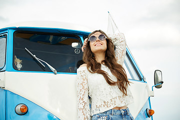 Image showing smiling young hippie woman in minivan car