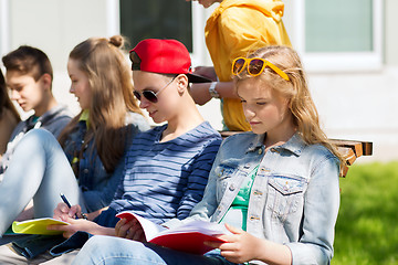 Image showing group of students with notebooks at school yard