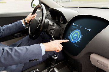 Image showing man driving car with eco mode on board computer