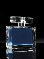 Image showing blue elegant perfume bottle in black background