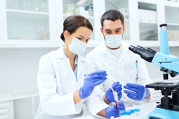 Image showing young scientists making test or research in lab