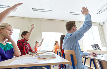 Image showing group of students with raised hands at high school