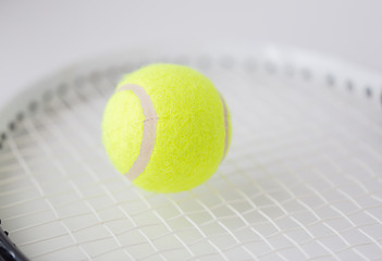 Image showing close up of tennis racket with ball