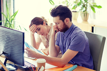 Image showing business team with computer and files in office