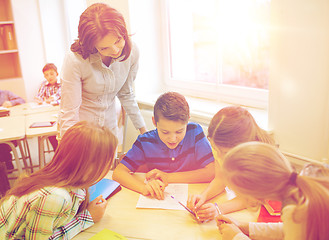 Image showing group of school kids writing test in classroom