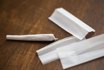 Image showing close up of marijuana joint and cigarette paper