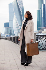 Image showing woman holding old wooden case