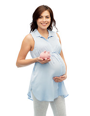 Image showing happy pregnant woman with piggybank