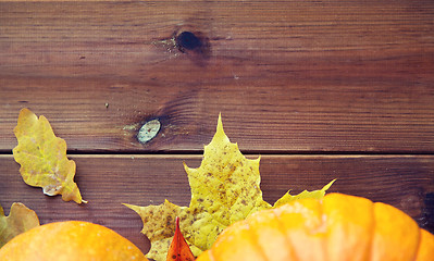 Image showing close up of pumpkins on wooden table at home