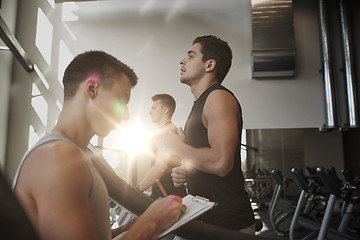 Image showing men exercising on treadmill in gym