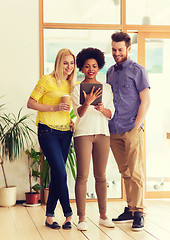 Image showing creative team with tablet pc and coffee at office