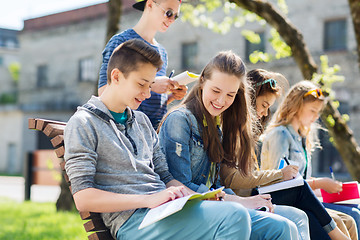 Image showing group of students with notebooks at school yard