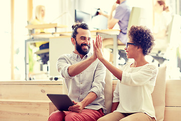 Image showing office workers with tablet pc making high five