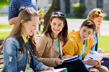 Image showing group of students with notebooks at school yard