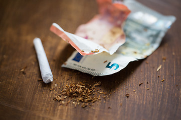 Image showing close up of marijuana joint and money