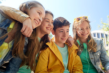 Image showing happy teenage students or friends outdoors