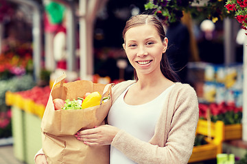 Image showing woman with bag of food at street market