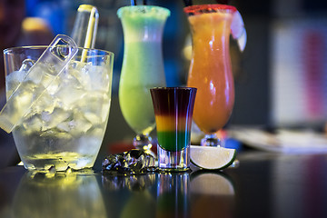 Image showing cocktails on bar background