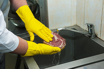 Image showing washing and cleaning meat