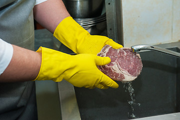 Image showing washing and cleaning meat