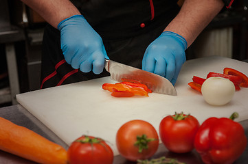 Image showing Chef cutting vegetables