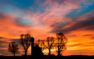 Image showing Early morning sunrise dawn with silhouette small church or chapel
