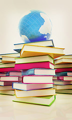 Image showing Colorful books and earth. 3D illustration. Vintage style.