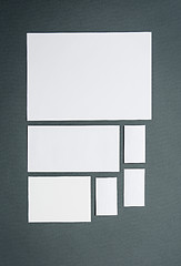 Image showing Mock-up business template with cards, papers. Gray background.