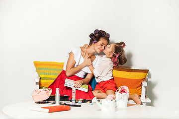 Image showing Little girl sitting with her mother and playing