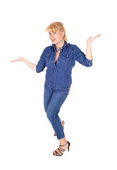 Image showing Woman standing gesturing with hands.