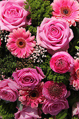 Image showing Ranunculus, roses and gerberas in a wedding arrangement