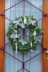 Image showing Christmas wreath on a glass door