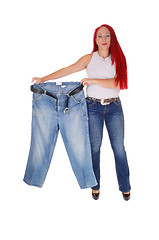 Image showing Woman holding big pants.