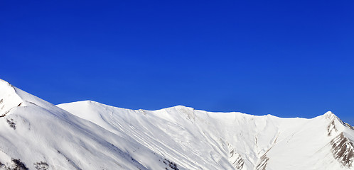 Image showing Panoramic view on snowy mountains at nice sun day