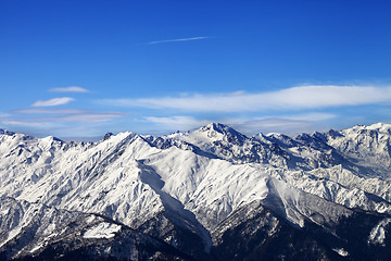 Image showing Snowy mountains and blue sky with clouds in nice sunny day